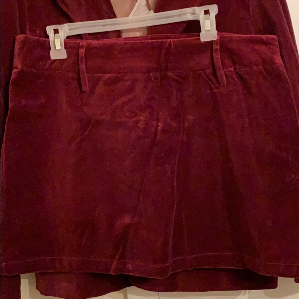 Deep burgundy suit smooth velvety feel.